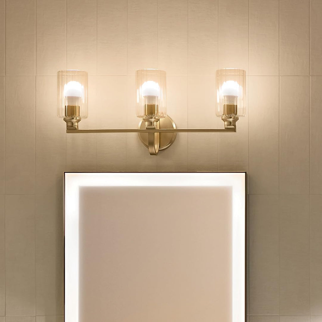 Kichler Gioe 24.25" 3-Light Bathroom Vanity Light Fixture with Clear Fluted Glass in Champagne Bronze, Damp Rated for Mirror, Powder Room (24.25" W x 10.5" H), 55226CPZFLU