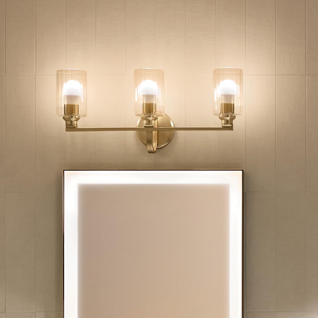 Kichler Gioe 24.25" 3-Light Bathroom Vanity Light Fixture with Clear Fluted Glass in Champagne Bronze, Damp Rated for Mirror, Powder Room (24.25" W x 10.5" H), 55226CPZFLU