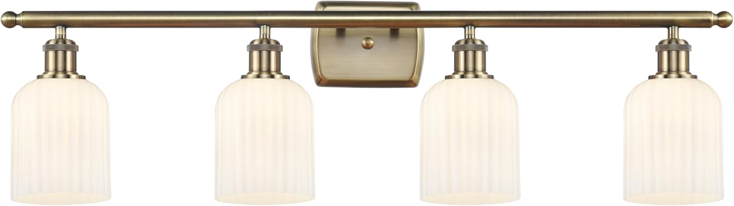 INNOVATIONS LIGHTING Ballston - Bridal Veil - 4 Light 35" Bath Vanity Light - Antique Brass Finish - Gloss White Shade